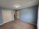 Bedroom with ample closet space, neutral carpeting, and a bright window at 3943 Dunaire Dr, Stone Mountain, GA 30083