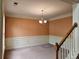 Cozy dining room features neutral walls and decorative wainscoting, creating an inviting atmosphere at 3943 Dunaire Dr, Stone Mountain, GA 30083