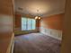 Inviting dining room with wainscoting, and a chandelier is filled with natural light at 3943 Dunaire Dr, Stone Mountain, GA 30083