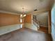 Spacious dining room with chair railing and chandelier, adjacent to the foyer and staircase at 3943 Dunaire Dr, Stone Mountain, GA 30083