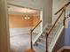 Inviting foyer with staircase and chandelier leads to a beautifully decorated living space at 3943 Dunaire Dr, Stone Mountain, GA 30083