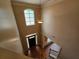 Spacious two-story foyer with hardwood floors, front door and window at 3943 Dunaire Dr, Stone Mountain, GA 30083