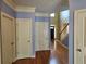 Welcoming foyer with hardwood floors and neutral walls leads to other rooms of the home at 3943 Dunaire Dr, Stone Mountain, GA 30083
