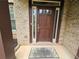 Inviting front door with glass accents and brick surround provides a warm welcome at 3943 Dunaire Dr, Stone Mountain, GA 30083