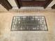 Close-up of a 'Welcome' mat at the front door on a concrete porch at 3943 Dunaire Dr, Stone Mountain, GA 30083