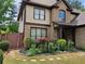 Charming two-story home with a well-maintained lawn and meticulously manicured landscaping at 3943 Dunaire Dr, Stone Mountain, GA 30083