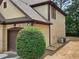 The garage exterior has an attached utility closet and beautiful landscaping at 3943 Dunaire Dr, Stone Mountain, GA 30083
