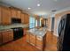 Charming kitchen boasts an island, stainless steel appliances, and hardwood floors at 3943 Dunaire Dr, Stone Mountain, GA 30083