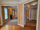 Open-concept living room leading to kitchen and foyer, with a fireplace and bright windows at 3943 Dunaire Dr, Stone Mountain, GA 30083