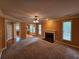 Comfortable living room with a fireplace, ceiling fan and view of the kitchen at 3943 Dunaire Dr, Stone Mountain, GA 30083