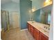 Updated main bathroom includes double vanity and walk-in glass shower at 3943 Dunaire Dr, Stone Mountain, GA 30083