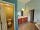 Elegant main bathroom features double vanity, toilet, tile floors, and lots of light at 3943 Dunaire Dr, Stone Mountain, GA 30083