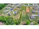 An aerial view showing property lines highlighting a two-story home with a spacious lawn in a residential neighborhood at 3985 Foxdale Ln, Cumming, GA 30028