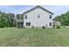 Wide backyard with a patio and screened porch, providing ample space for recreation and leisure at 3985 Foxdale Ln, Cumming, GA 30028