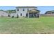 Spacious backyard with a patio and screened porch, ideal for outdoor living and entertaining at 3985 Foxdale Ln, Cumming, GA 30028