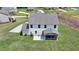 Aerial view of home showcasing a large yard with a patio and screened in porch at 3985 Foxdale Ln, Cumming, GA 30028