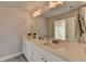 Bathroom features a double sink vanity with white cabinets and bronze fixtures at 3985 Foxdale Ln, Cumming, GA 30028