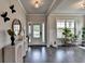 Bright foyer featuring wood floors, neutral walls, modern decor, and great natural light at 3985 Foxdale Ln, Cumming, GA 30028