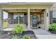 Inviting front porch showcases a stone facade, manicured landscaping, and a stylish entrance at 3985 Foxdale Ln, Cumming, GA 30028