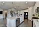 Contemporary kitchen with white cabinets, stainless steel appliances, quartz countertops, and open concept design at 3985 Foxdale Ln, Cumming, GA 30028