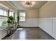 Inviting living room featuring wood floors, neutral walls, and great natural light at 3985 Foxdale Ln, Cumming, GA 30028