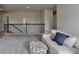 Open loft with comfortable seating, neutral colors and wrought iron railing at 3985 Foxdale Ln, Cumming, GA 30028
