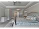 The main bedroom features a decorative ceiling, neutral color palette, and is carpeted at 3985 Foxdale Ln, Cumming, GA 30028