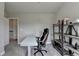 Office featuring an adjustable height desk, shelf, and comfortable office chair at 3985 Foxdale Ln, Cumming, GA 30028