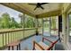 Comfortable screened porch with ample space and views, excellent for entertaining or unwinding at 3985 Foxdale Ln, Cumming, GA 30028
