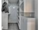 This walk-in closet is carpeted, has built-in shelving, and storage cabinets at 3985 Foxdale Ln, Cumming, GA 30028