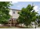 Backyard view featuring a deck, green lawn, and mature trees offering shade and privacy at 532 Walton Dr, Woodstock, GA 30188