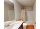 Bright bathroom featuring a vanity, mirror, shower-tub combination, and tile flooring at 532 Walton Dr, Woodstock, GA 30188