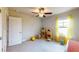 bedroom with a ceiling fan, window, carpet and toys at 532 Walton Dr, Woodstock, GA 30188