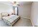 Well-lit bedroom featuring a bed, nightstand, window with curtains and door at 532 Walton Dr, Woodstock, GA 30188