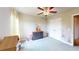 Large bedroom featuring natural light, neutral carpet, ceiling fan, closet, and furnishings at 532 Walton Dr, Woodstock, GA 30188