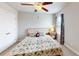 Bedroom featuring a bed, nightstand, window with curtains and a door at 532 Walton Dr, Woodstock, GA 30188