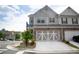 Beautiful home exterior with a two-car garage and a manicured front yard at 532 Walton Dr, Woodstock, GA 30188