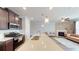 Kitchen with stainless appliances, large kitchen island, and views of the living room and fireplace at 532 Walton Dr, Woodstock, GA 30188