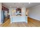 Spacious kitchen with stainless steel appliances, quartz counters, and modern pendant lighting at 532 Walton Dr, Woodstock, GA 30188