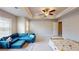 Main bedroom featuring a ceiling fan, recessed lighting, and a comfortable seating area at 532 Walton Dr, Woodstock, GA 30188