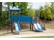 Community playground area featuring slides and climbing structure for to enjoy at 532 Walton Dr, Woodstock, GA 30188