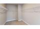 Spacious walk-in closet offering ample storage space with wire shelving and neutral carpet at 532 Walton Dr, Woodstock, GA 30188