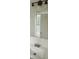 Bright bathroom featuring a vanity with modern faucet, and a large mirror reflecting natural light at 991 Park Creek Cir, Lawrenceville, GA 30044