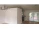 Bright dining area with modern chandelier, neutral paint, and access to outdoor deck at 991 Park Creek Cir, Lawrenceville, GA 30044
