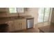 The modern kitchen features a stainless steel dishwasher, granite countertops and a sink at 991 Park Creek Cir, Lawrenceville, GA 30044