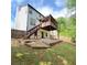Spacious backyard with tiered landscaping and a charming covered deck at 210 Paris Dr, Lawrenceville, GA 30043