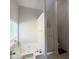 Well-lit bathroom featuring a soaking tub and a separate shower stall at 210 Paris Dr, Lawrenceville, GA 30043