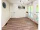 Bright dining area with wood floors, large windows, and modern decor; access to outdoor area at 210 Paris Dr, Lawrenceville, GA 30043