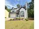 Charming two-story home with a well-manicured front yard and an attached garage at 210 Paris Dr, Lawrenceville, GA 30043