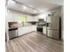Well-lit kitchen featuring modern appliances, ample cabinet space, and sleek countertops at 210 Paris Dr, Lawrenceville, GA 30043